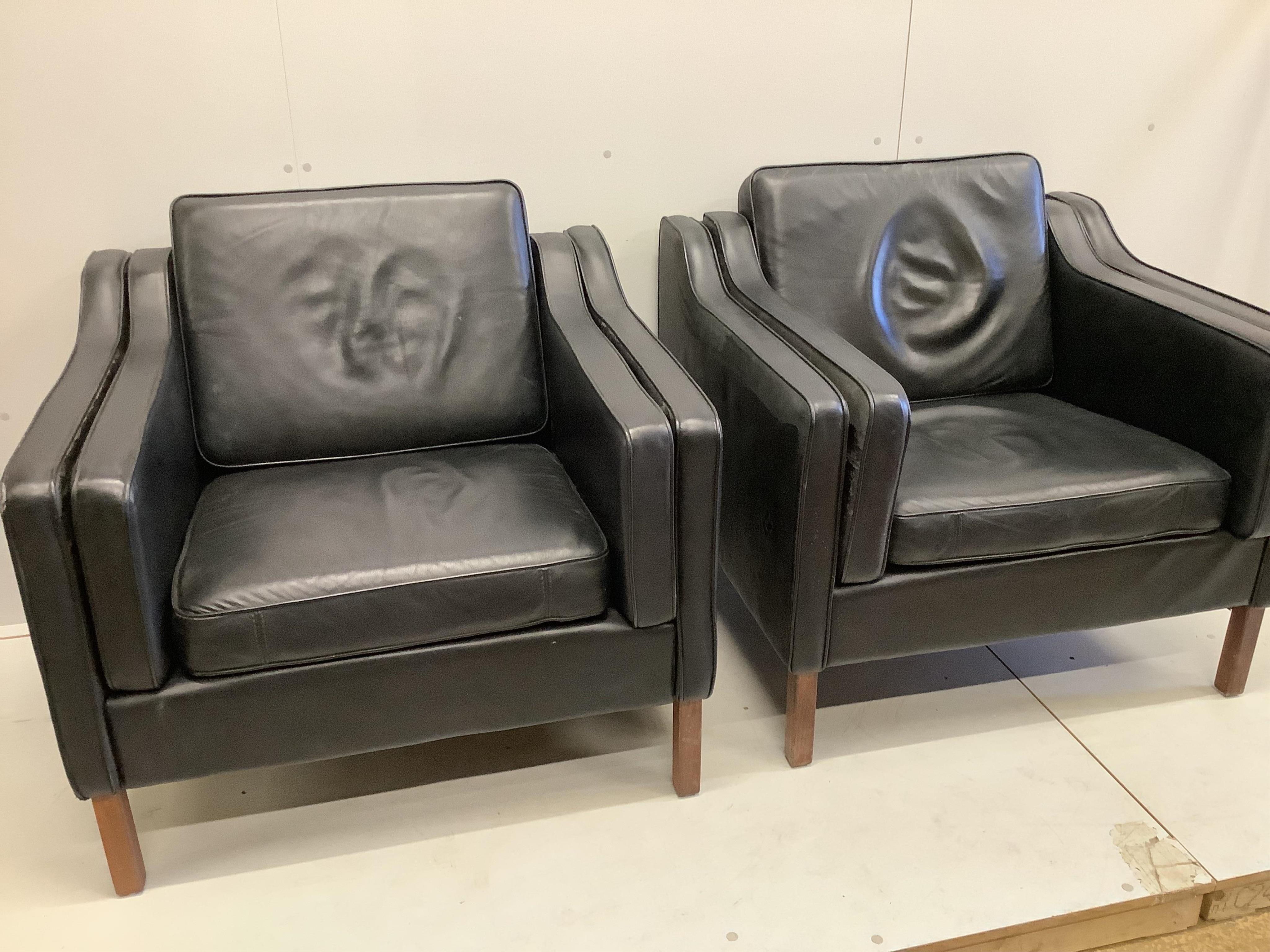In the manner of Morgensen, a pair of black leatherette armchairs, width 92cm, depth 80cm, height 82cm. Condition - fair